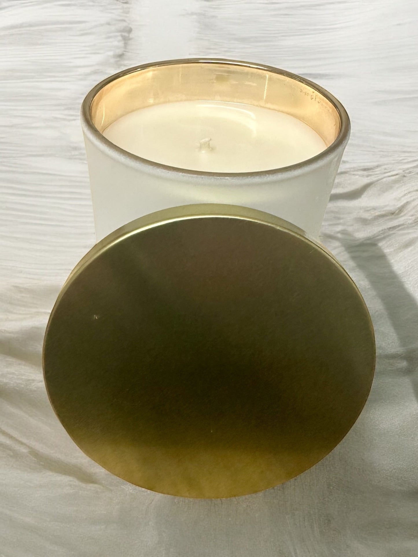 Fresh Mountain Air luxury hand-poured soy blend candle in white jar with gold lid.