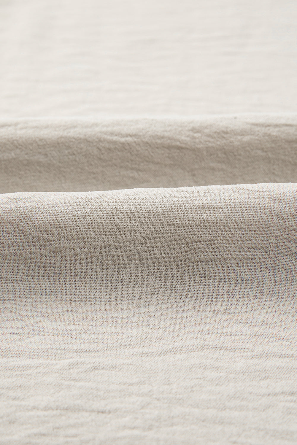 Close-up of beige fabric with a subtle texture
