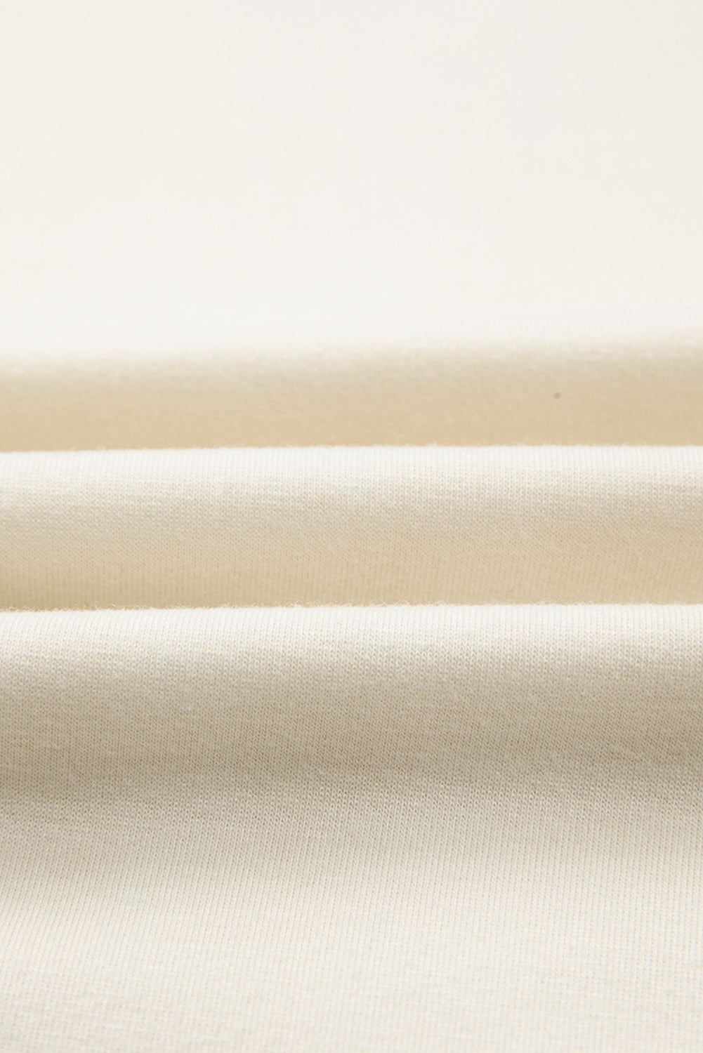Close-up of beige fabric with a subtle texture