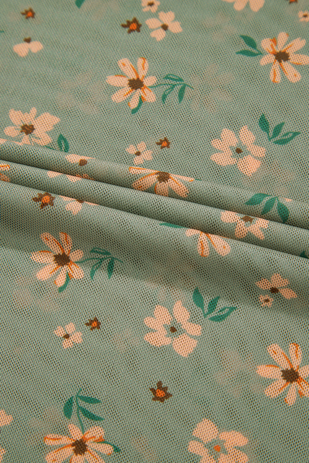 Fabric with floral pattern on a green background