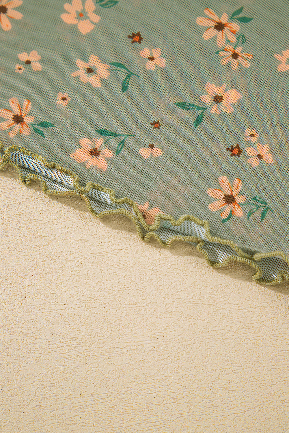 Floral lace trim on a textured fabric background