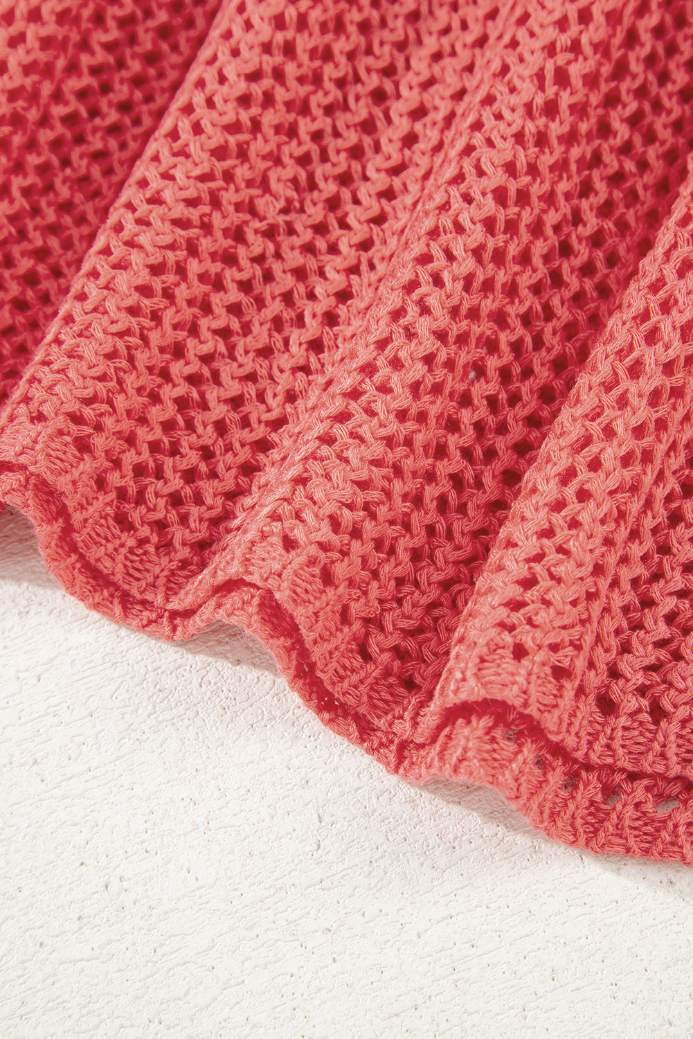 Close-up of a textured red fabric on a white background
