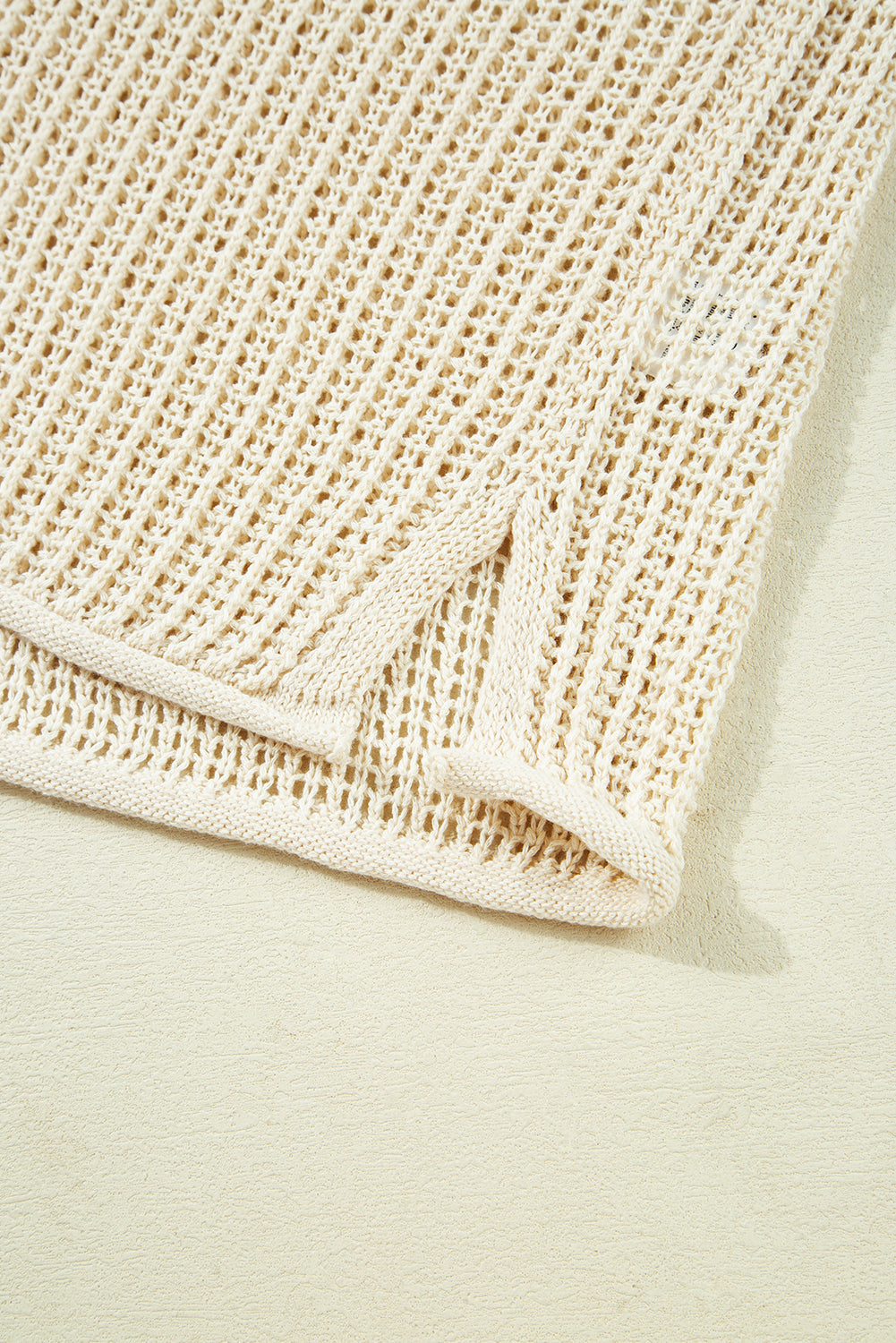 Close-up of a beige textured fabric on a light background