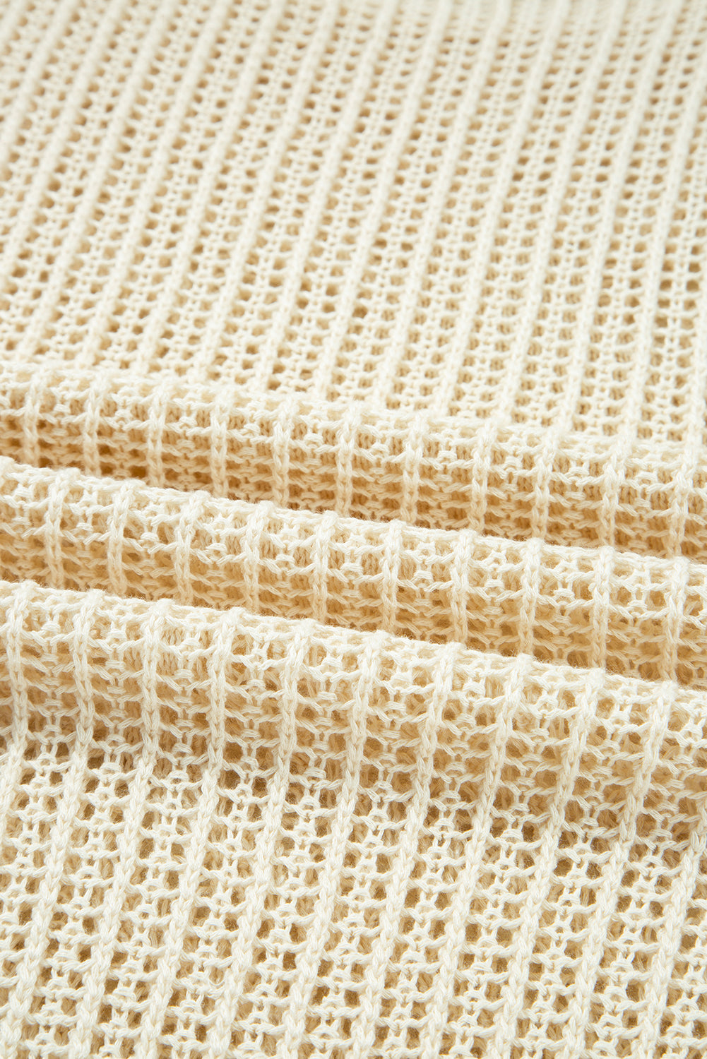Close-up of beige woven fabric texture