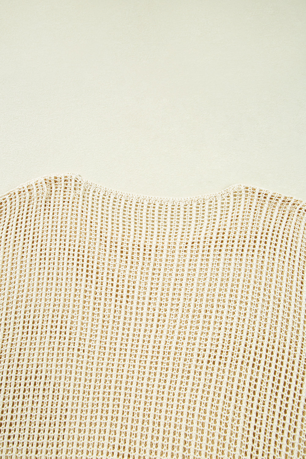 Close-up of beige woven fabric texture