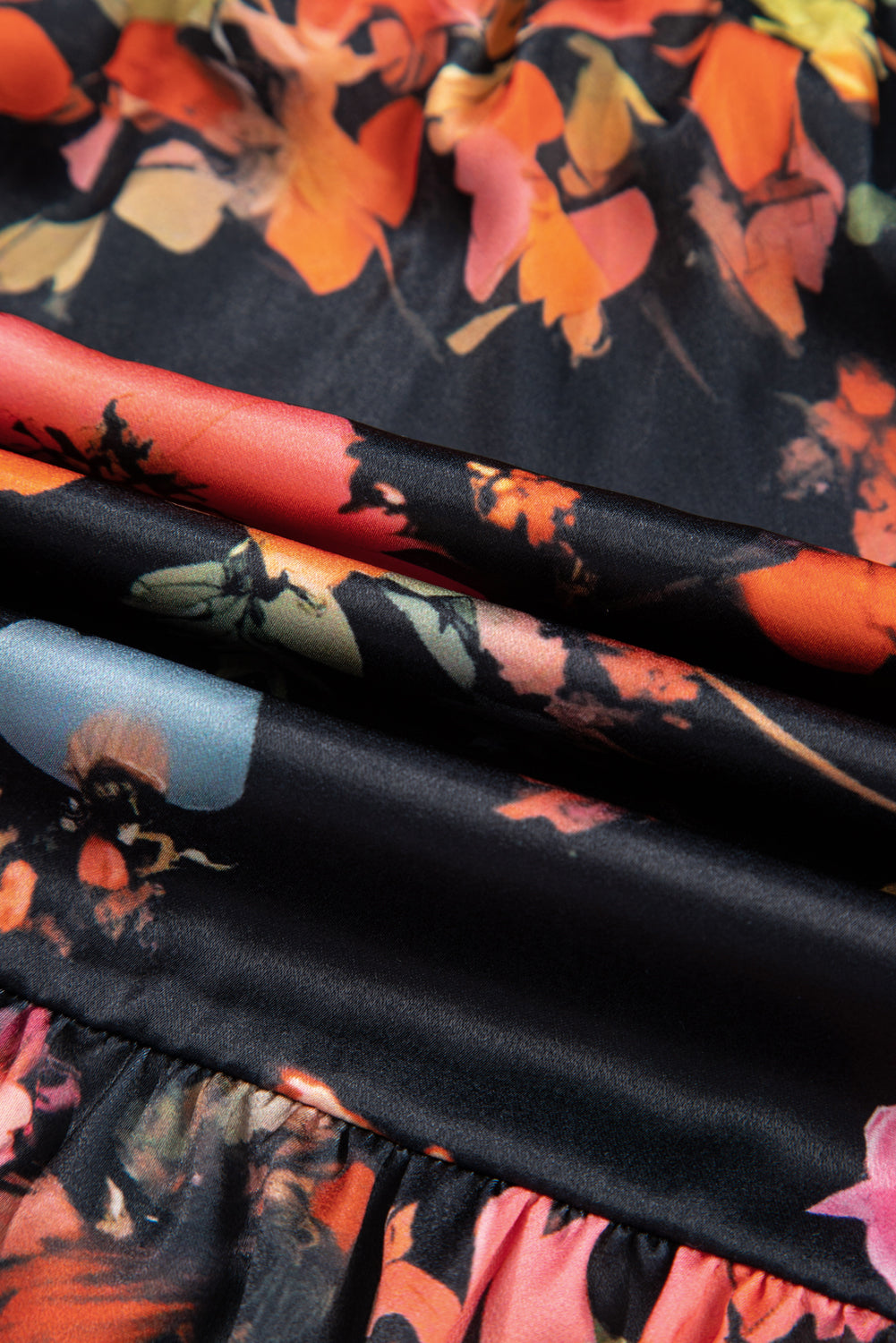Close-up of fabric with floral pattern on black background
