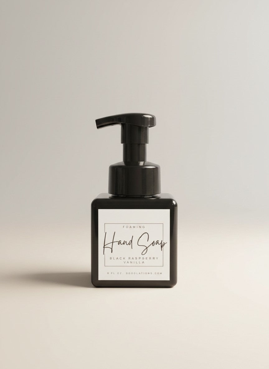 Doodlations Coffee Bar & Boutique black raspberry vanilla foaming hand soap in a square black bottle with a black pump.