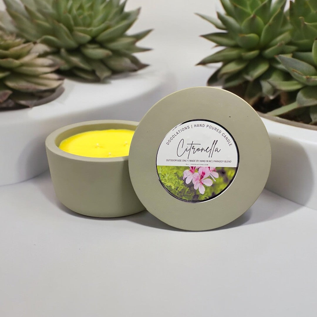 Doodlations Citronella 3-wick concrete candle with yellow soy blend wax, perfect for outdoor ambiance.