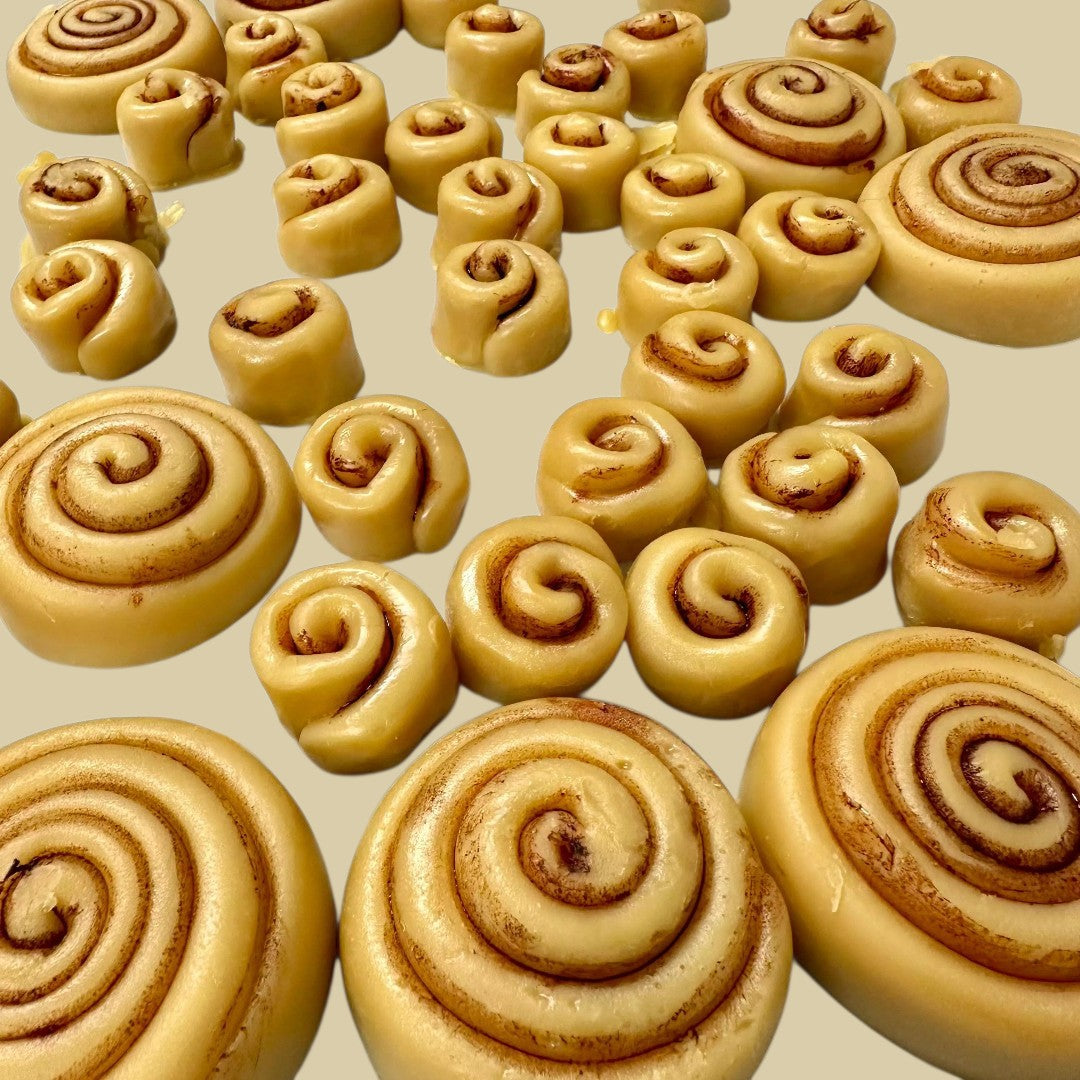 Doodlations Coffee Bar & Boutique Cinnamon Roll wax melts, shaped like mini cinnamon rolls with swirled brown cinnamon filling.