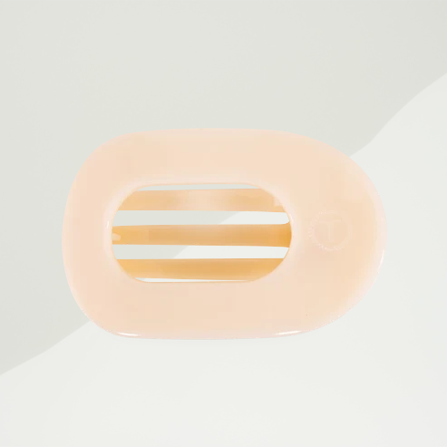 Doodlations Coffee Bar & Boutique almond beige flat round hair clip with bendable teeth for comfortable all-day wear.