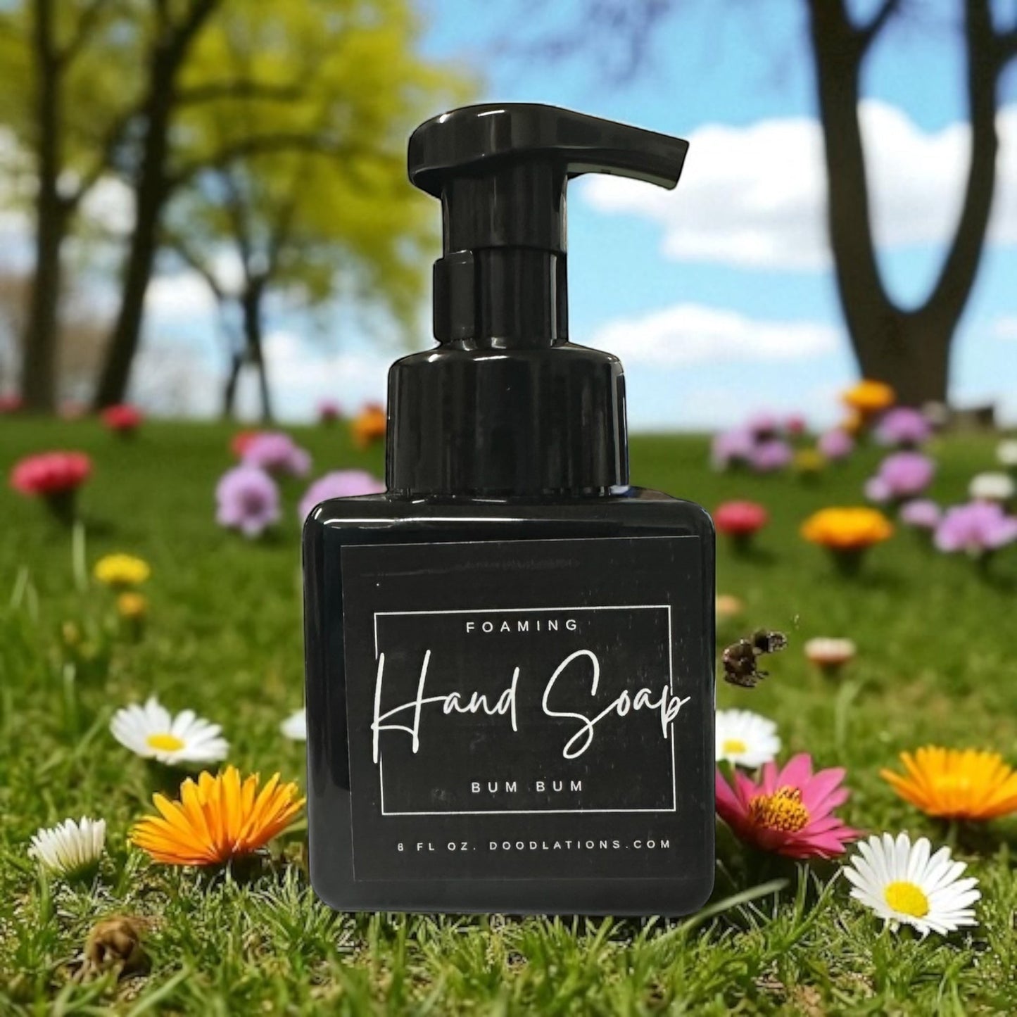Doodlations Coffee Bar & Boutique Bum Bum foaming hand soap in a black bottle with a tropical floral background.