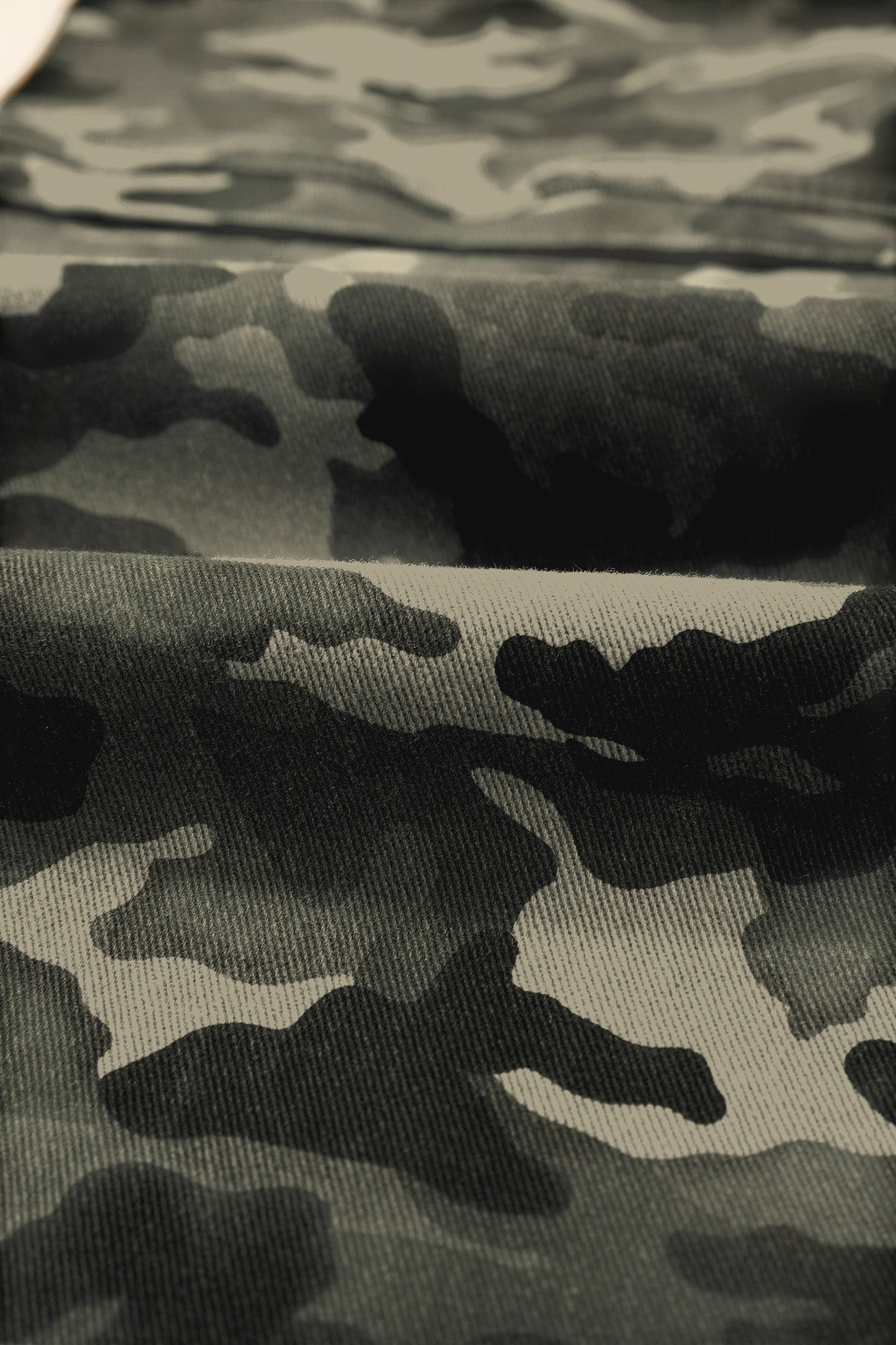 Doodlations Coffee Bar & Boutique camouflage print fabric close-up of durable utility cargo pants