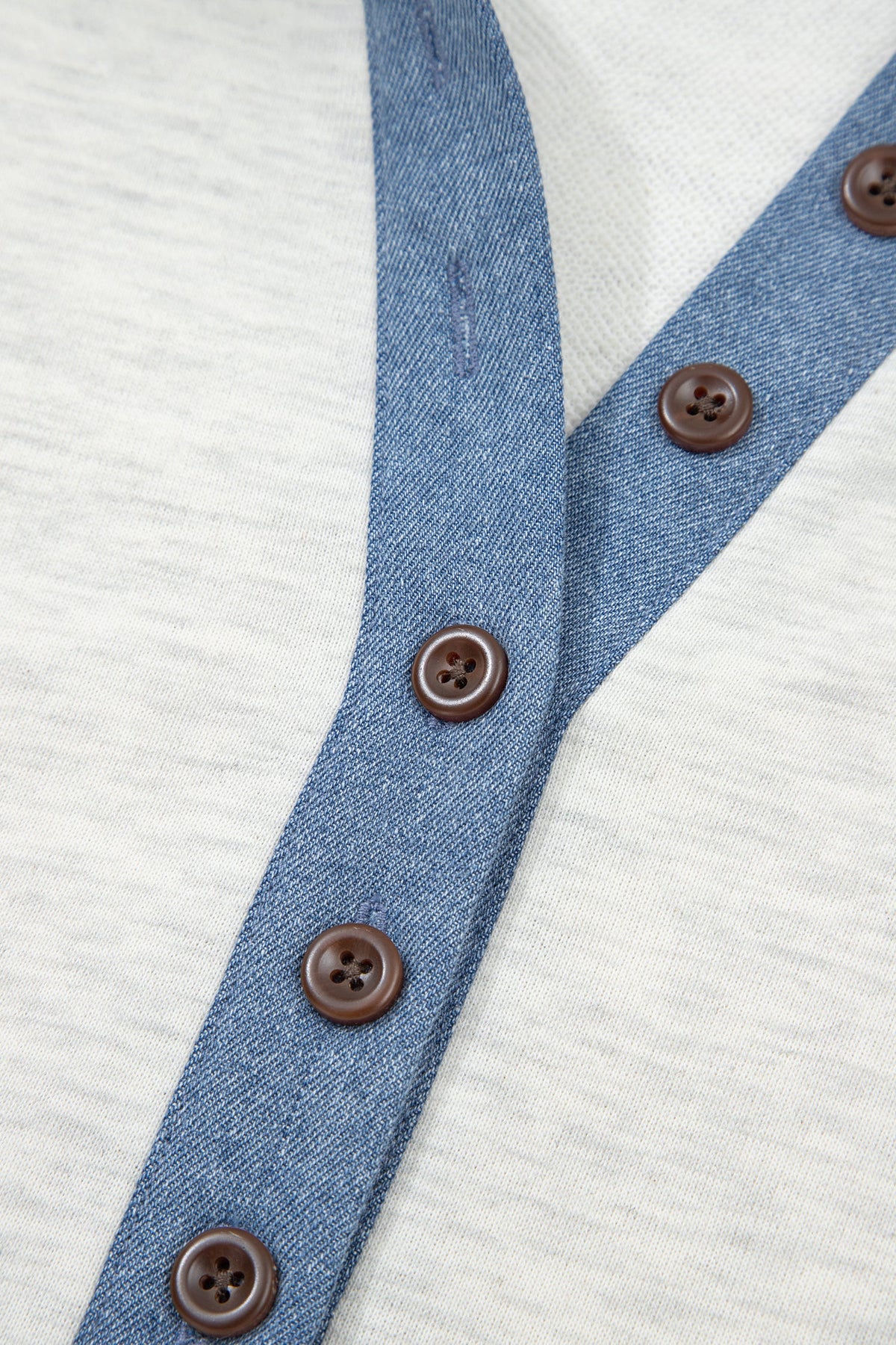 Doodlations Coffee Bar & Boutique light grey denim patchwork long sleeve top with a button front and polo collar