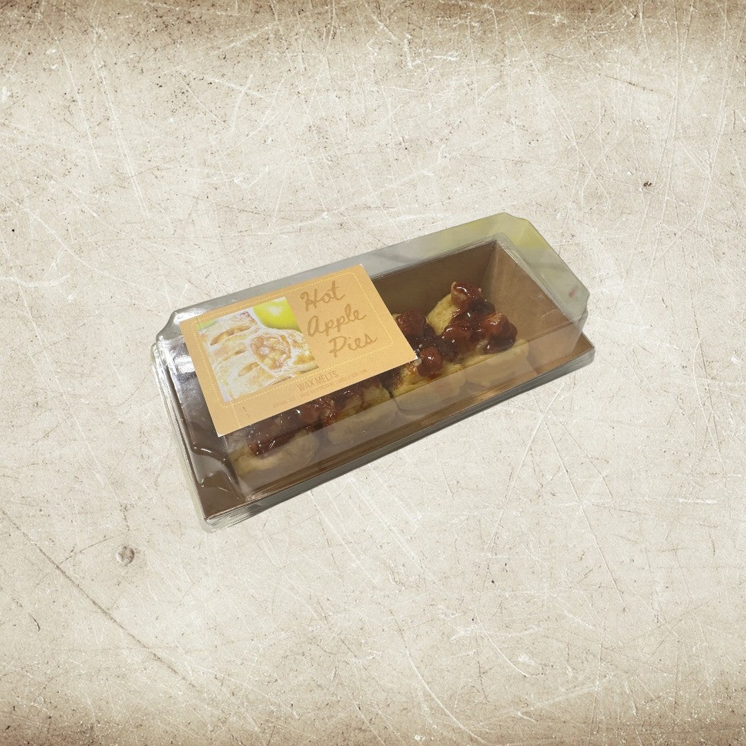 Doodlations Hot Apple Pies wax melts in a clear plastic container with a label depicting apple pie slices.
