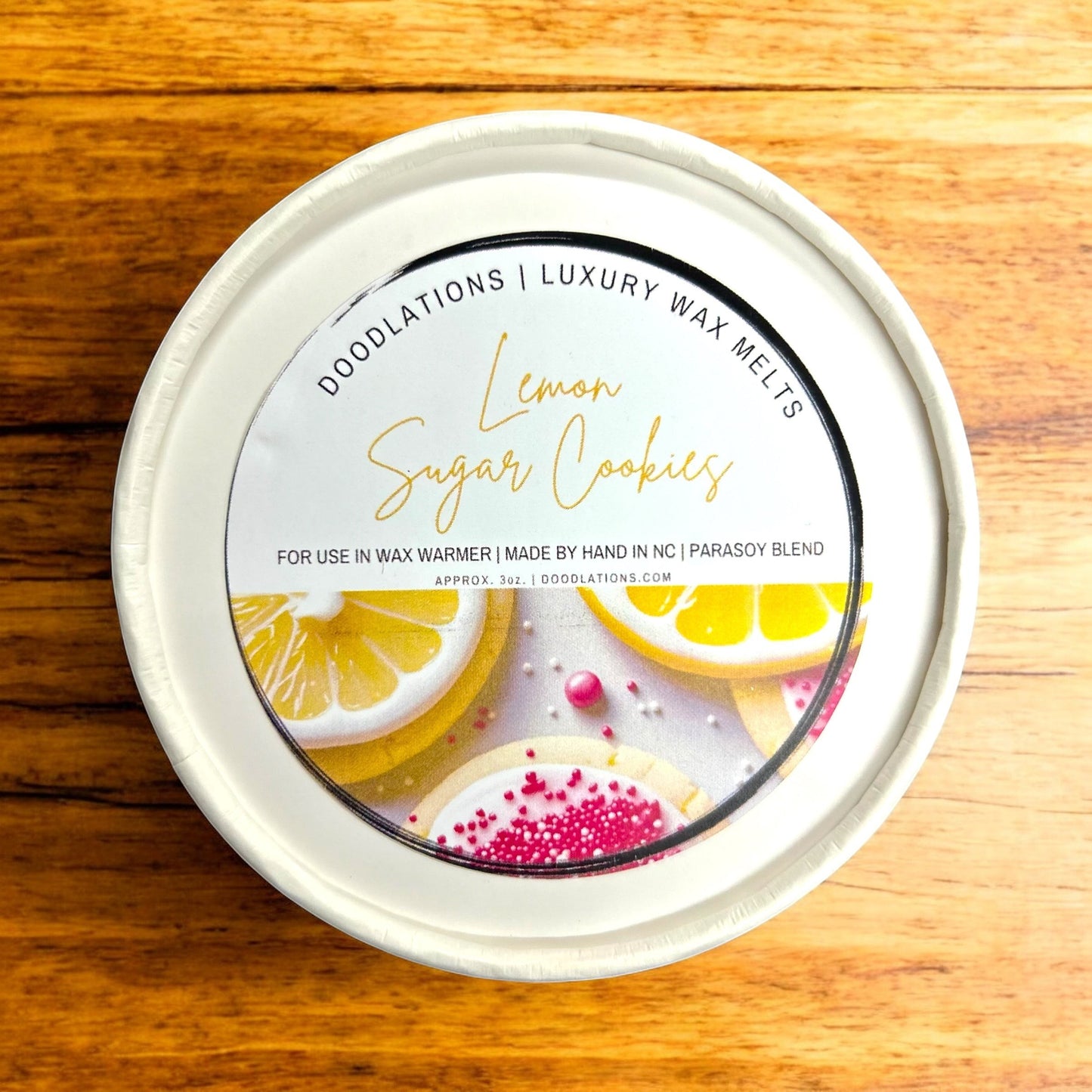 Doodlations Luxury Wax Melts in Lemon Sugar Cookies scent, featuring realistic lemon slices and decorated sugar cookies.