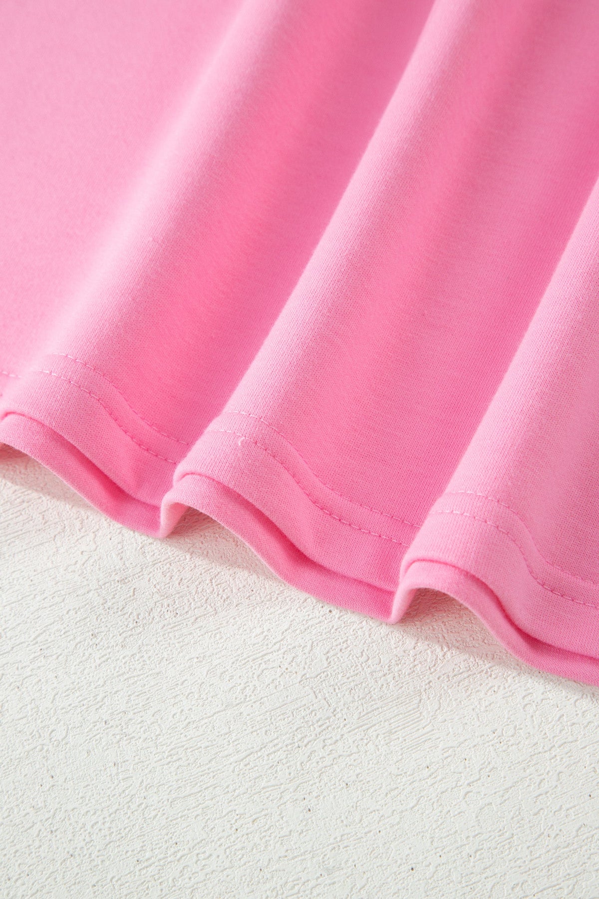 Doodlations Coffee Bar & Boutique pink soft cotton fabric texture of a lounge set with visible stitching detail