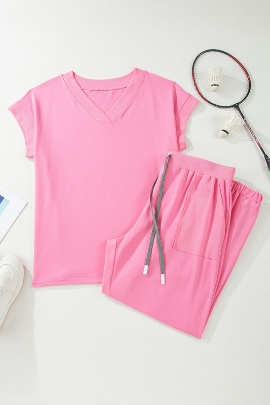 Doodlations Coffee Bar & Boutique pink V-neck lounge set with short sleeves, drawstring pants, and side pockets.