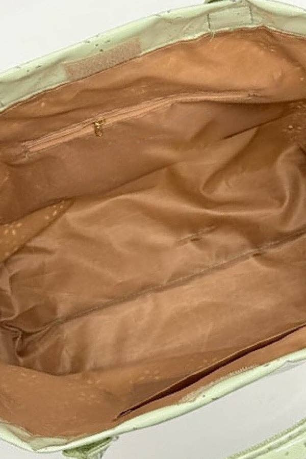 Interior view of Doodlations Coffee Bar & Boutique tote bag with tan lining, zipper pocket, and light green trim.