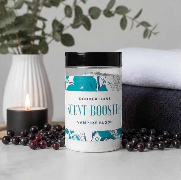 Doodlations Coffee Bar & Boutique Vampire Blood laundry scent booster in a clear jar with a black lid, featuring floral accents.