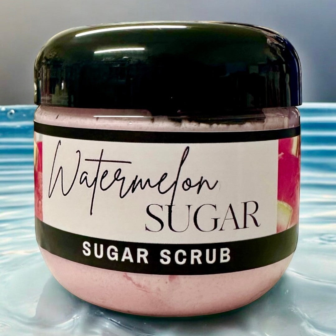 Doodlations Coffee Bar & Boutique Watermelon Sugar Scrub in a clear jar with a black lid, pink scrub inside.