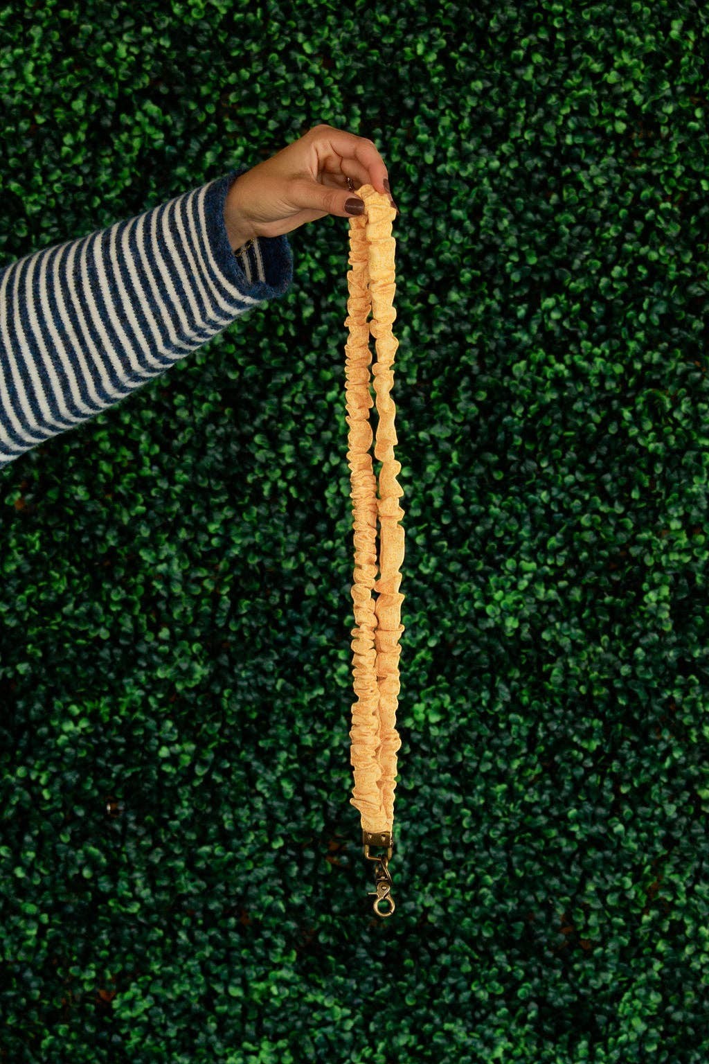 Doodlations Coffee Bar & Boutique Bloom lanyard in yellow floral linen fabric with a gold metal clasp