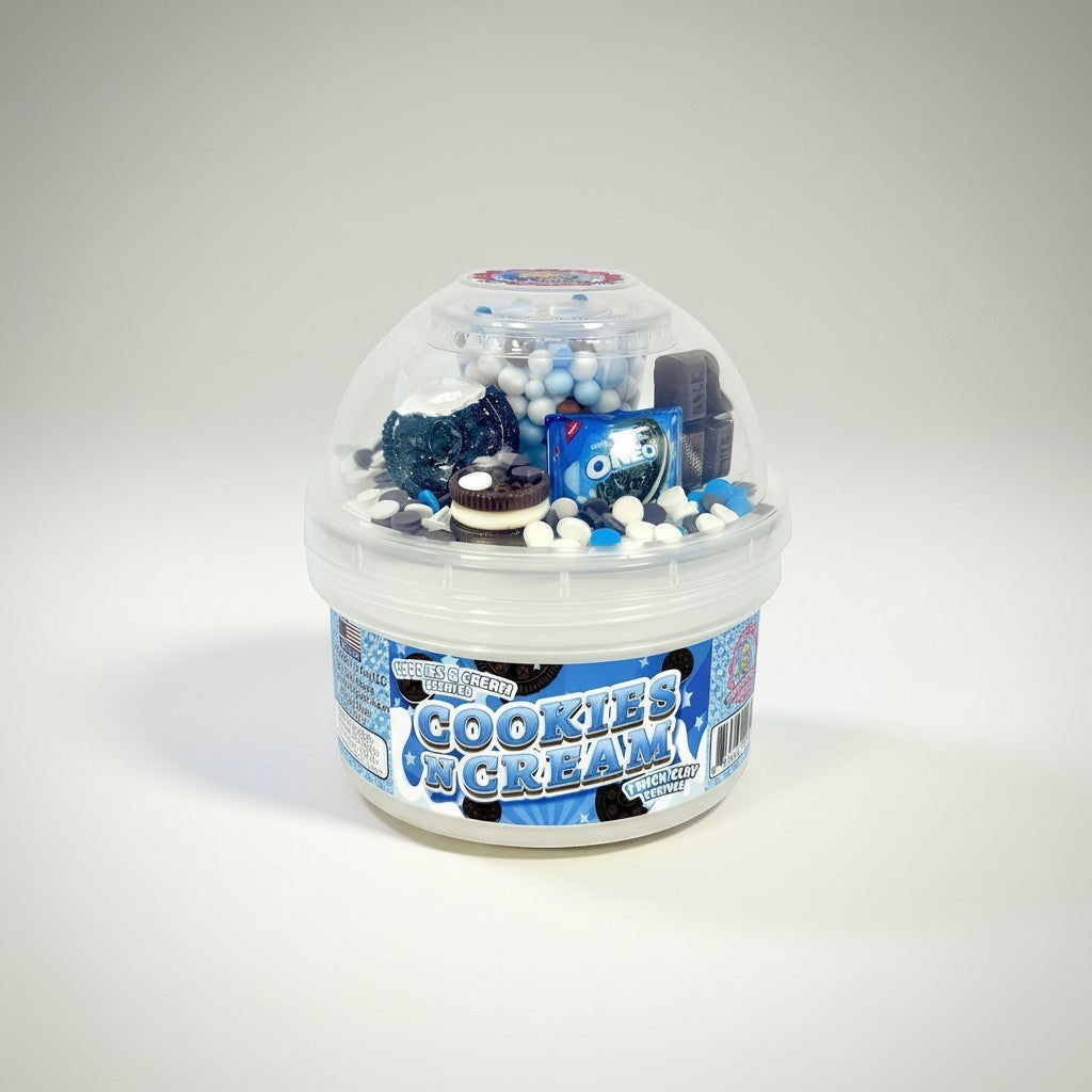 Doodlations Coffee Bar & Boutique Cookies and Cream Scented Slime in a clear container with blue and white sprinkles, mini Oreo cookies, and blue charms.