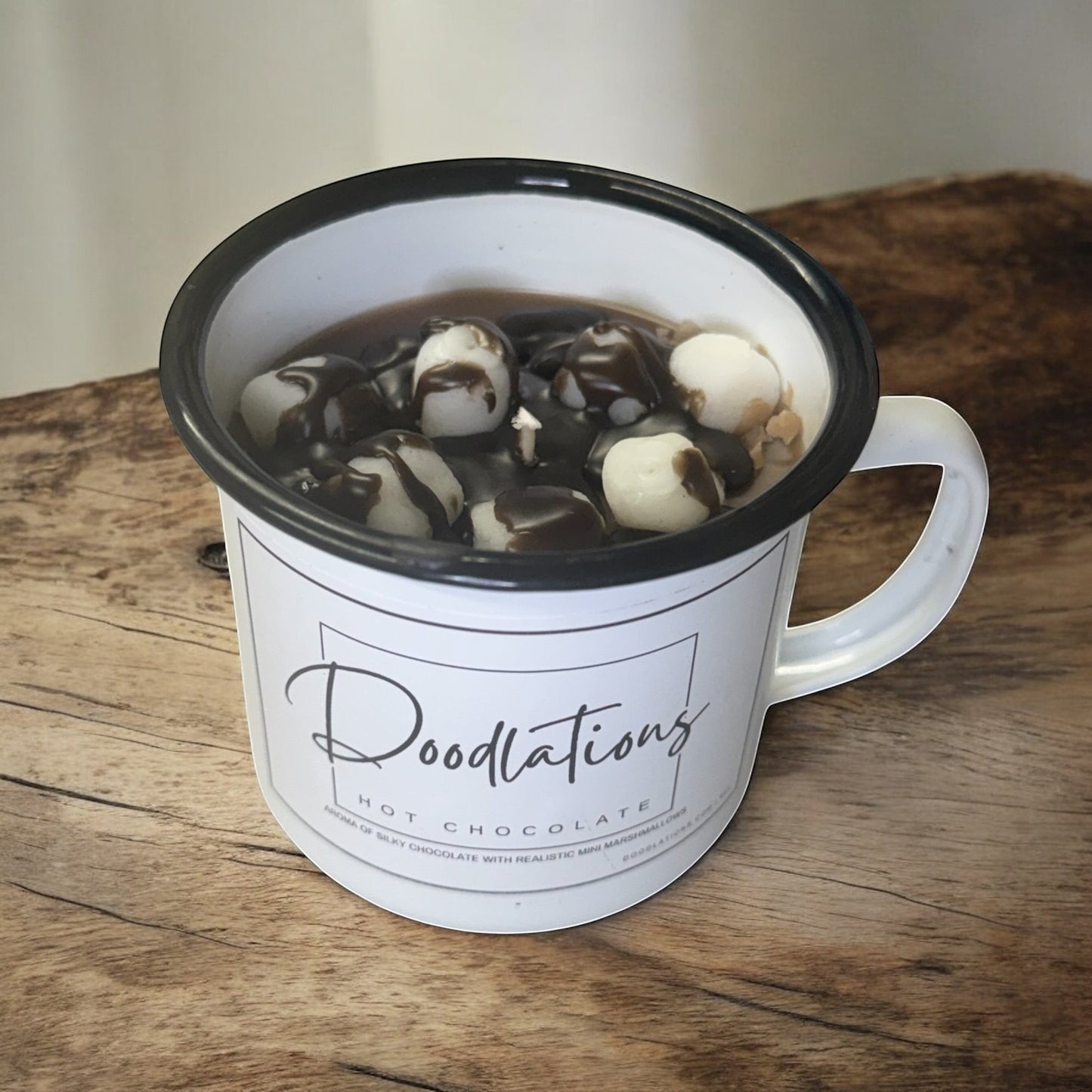 Doodlations enamel camping mug candle with realistic hot chocolate and marshmallows design.