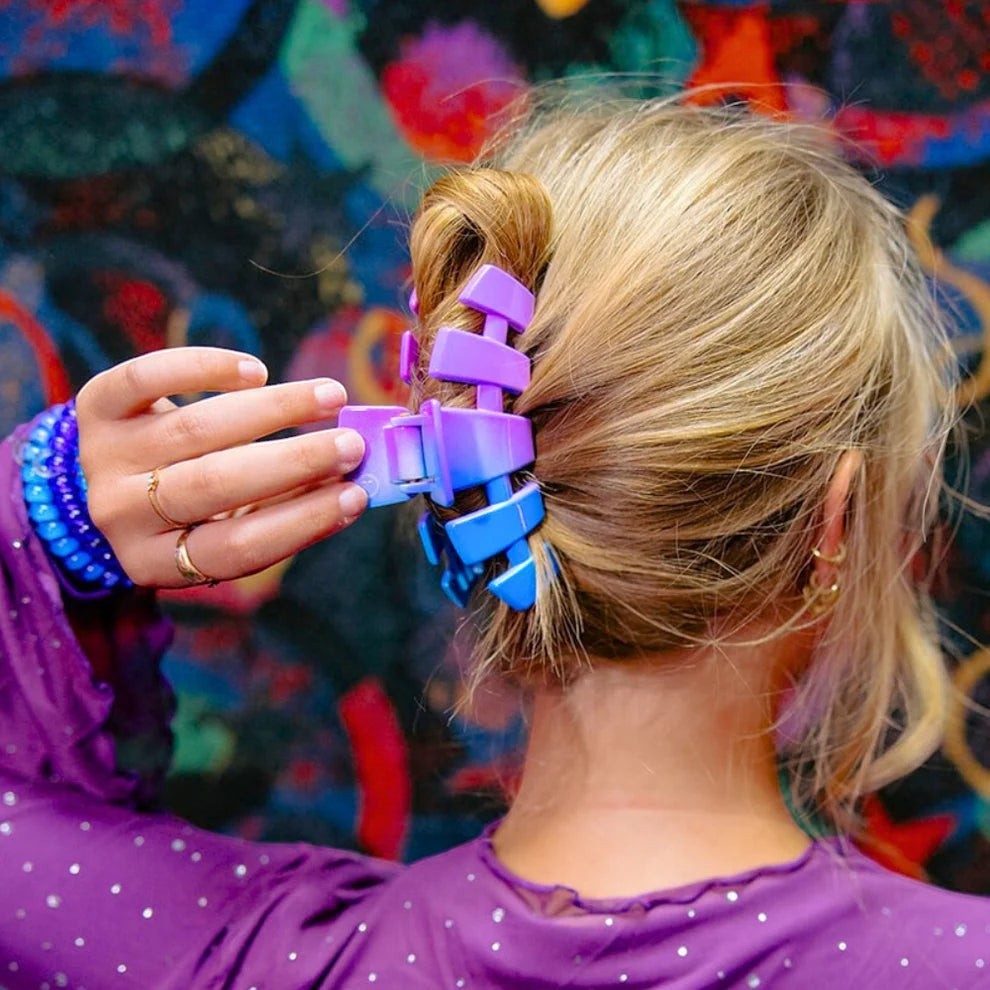 Doodlations Coffee Bar & Boutique Miami Vice blue and purple gradient hair claw clip holding blonde hair in an updo.