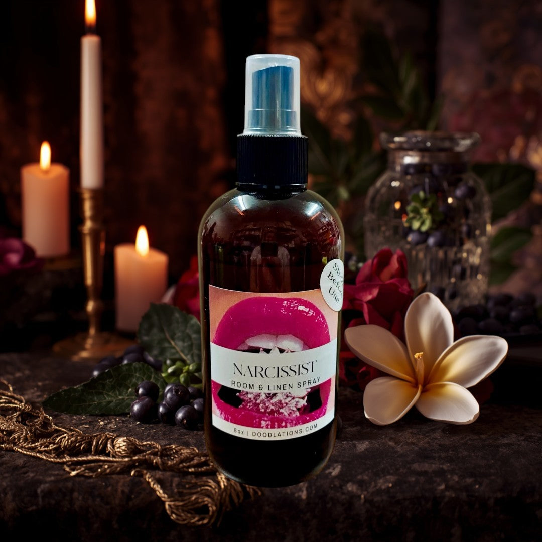 Doodlations Narcissist room and linen spray in amber bottle with a bold fruity-floral scent.