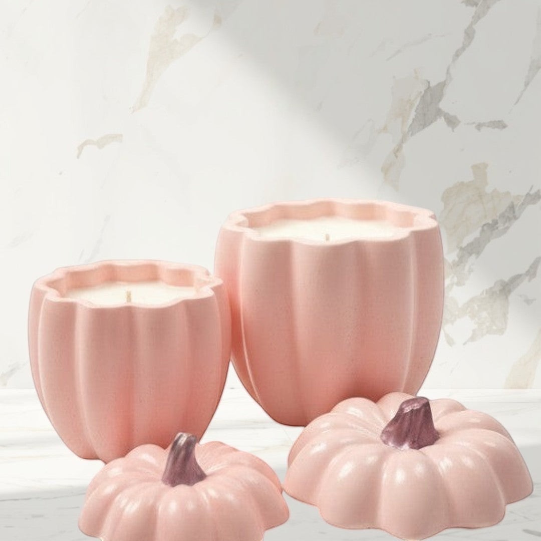 Doodlations pink concrete pumpkin candles in two sizes with matching lids. Autumnal home decor.