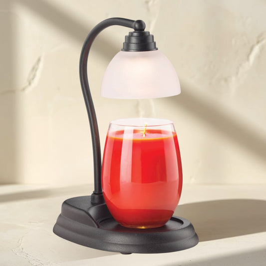 Aurora black candle warmer lamp with frosted shade and red candle.