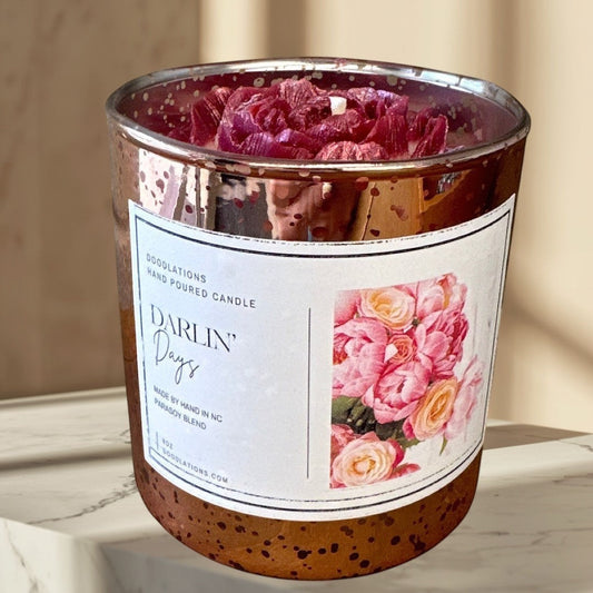 Darlin' Days floral candle in a rose gold mercury glass jar with pink and cream rose decorations.