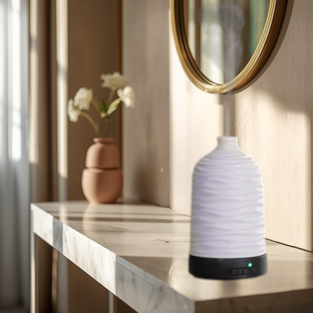 white wavy ceramic essential oil diffuser with green LED light