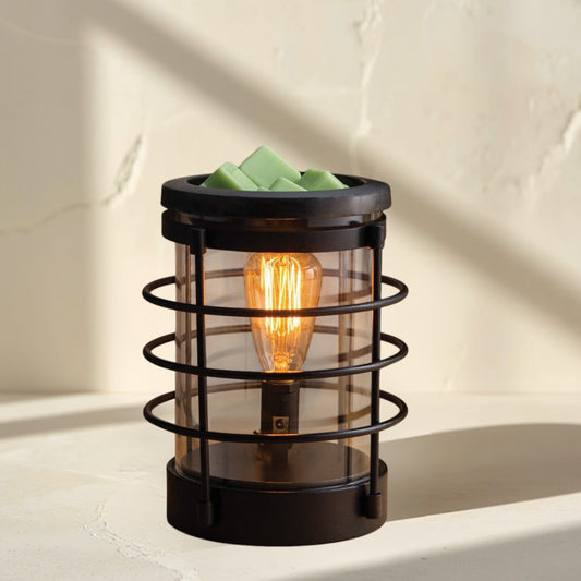 Coastal Vintage Bulb Illumination wax warmer with green wax melts and a warm glowing bulb.