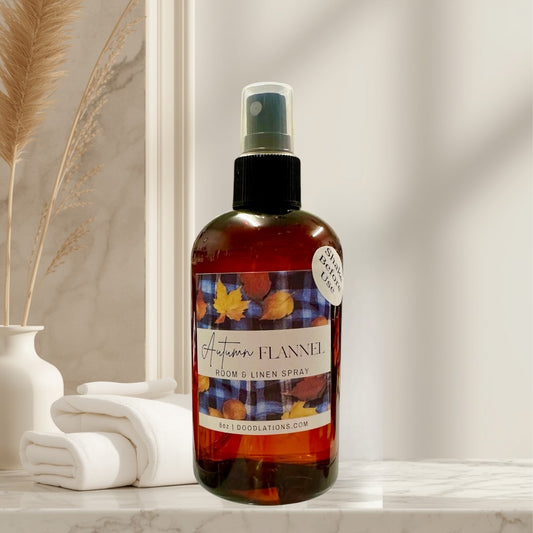 Autumn Flannel room and linen spray in amber bottle with fall leaf label.