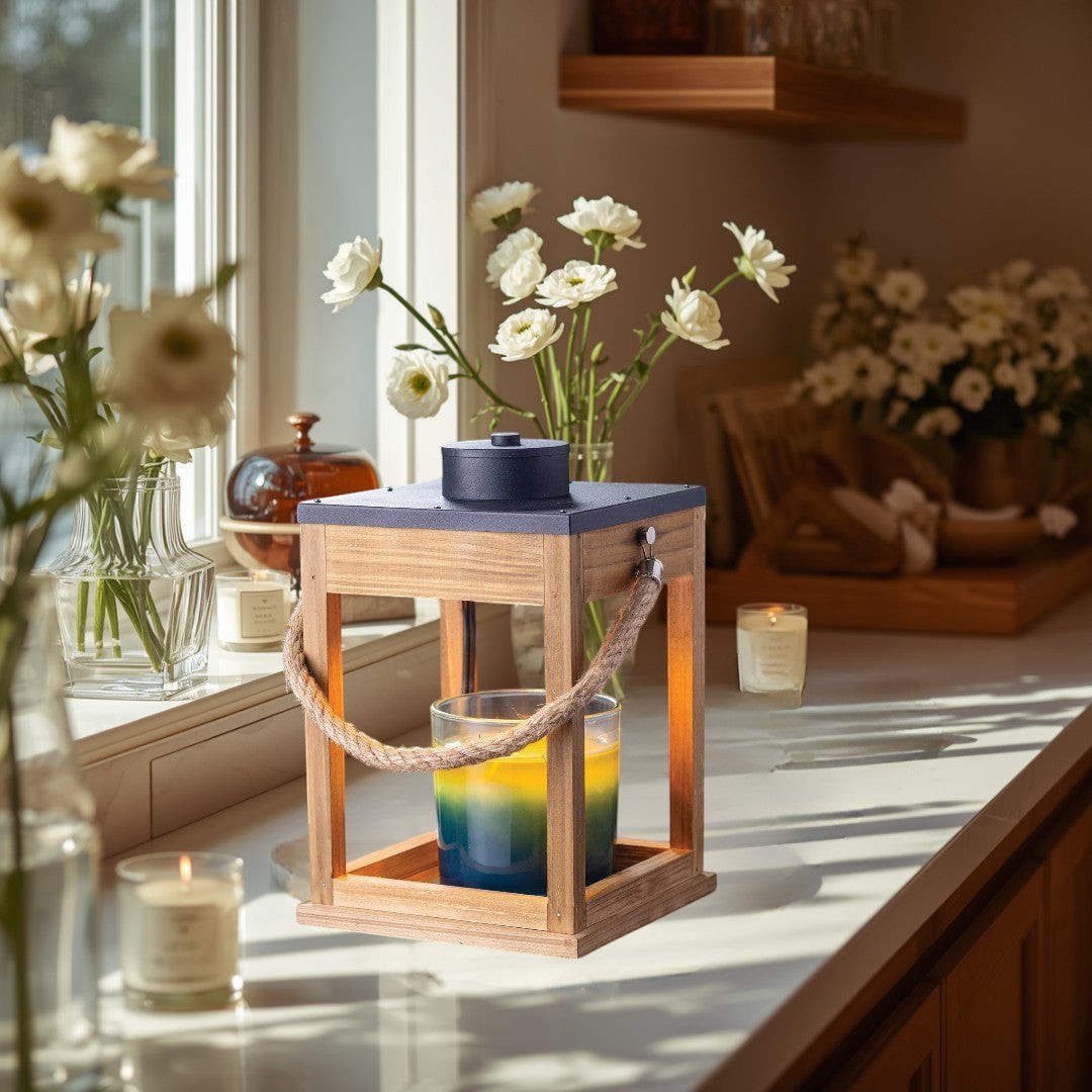 wood and rope candle warmer lantern with black top and silver accents.