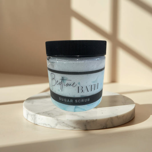 Bedtime Bath sugar scrub in a clear jar with a black lid,