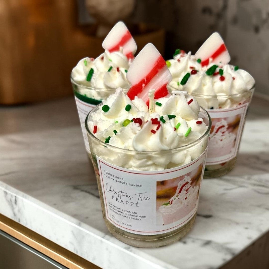 Christmas Tree Frappe candle with whipped wax topping, sprinkles, and candy cane accent.