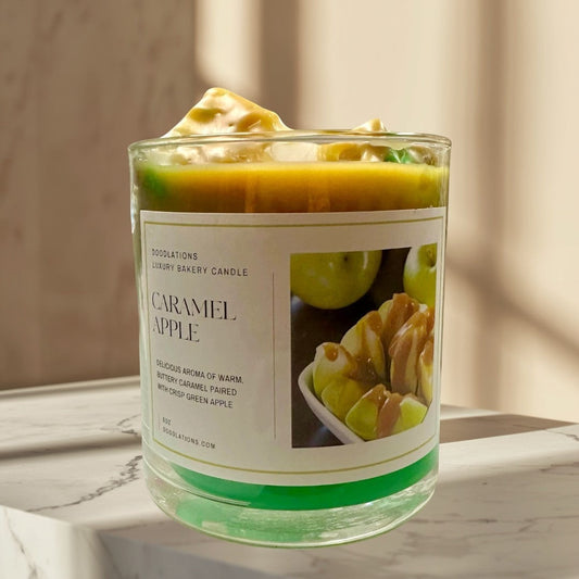 Apple Caramel Candle with green wax base and caramel-topped apple slices on label.