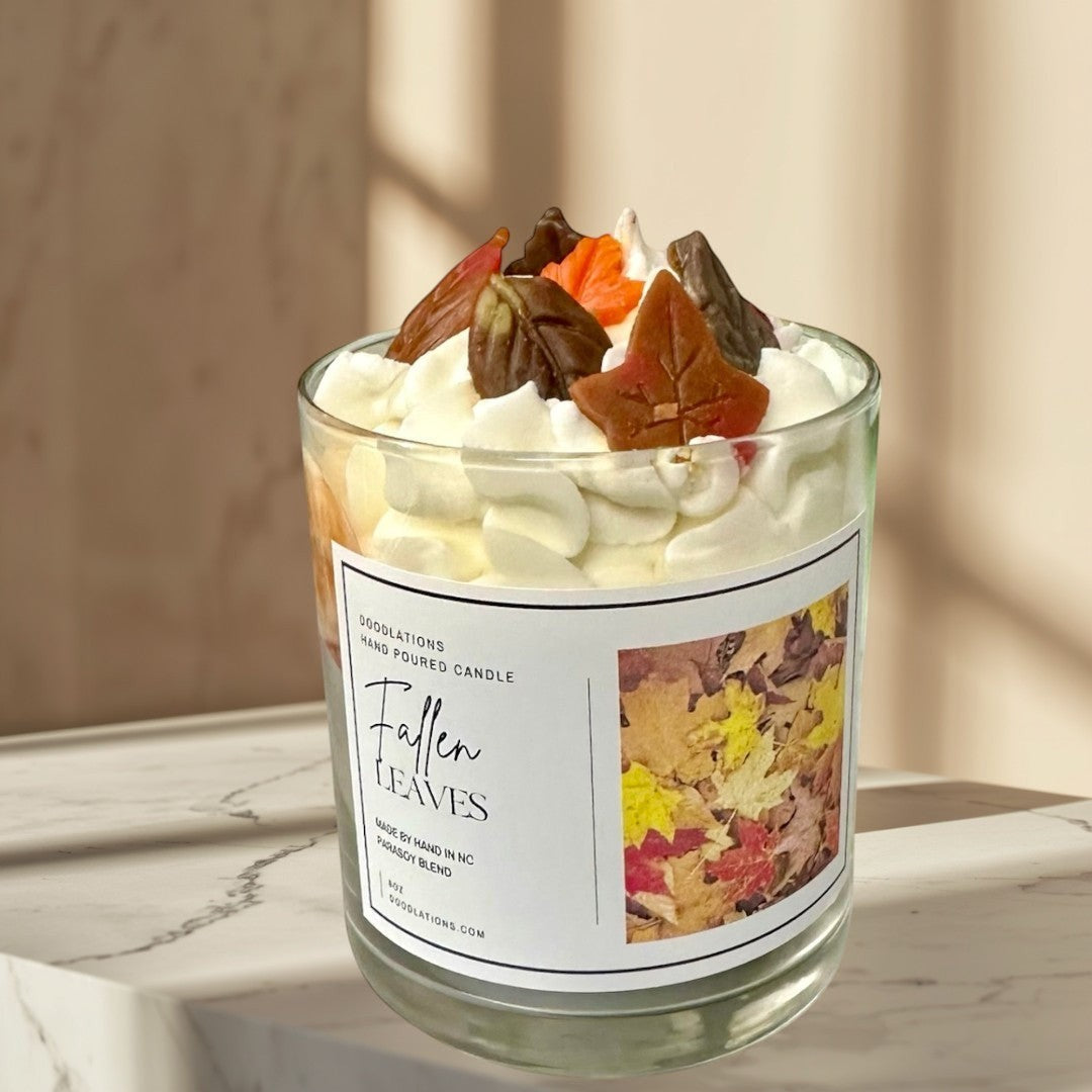 Doodlations Coffee Bar & Boutique Fallen Leaves hand-poured candle with realistic wax leaves and autumn scent.