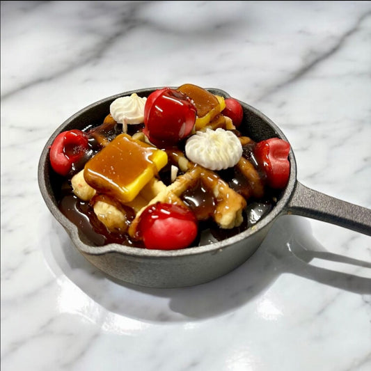 Cherry Waffle Skillet Candle with 3 wicks, topped with cherries, caramel, and whipped cream.