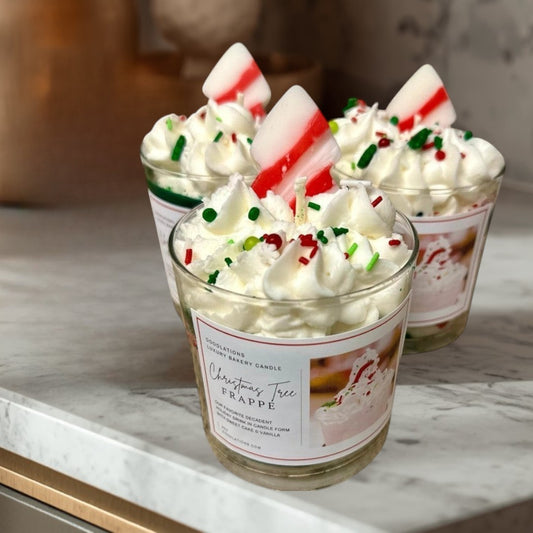 Christmas Tree Frappe candle with whipped wax topping, sprinkles, and candy cane accent.