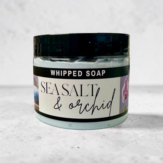 Doodlations Coffee Bar & Boutique Sea Salt & Orchid whipped soap in a 4oz jar with a black lid and floral label.