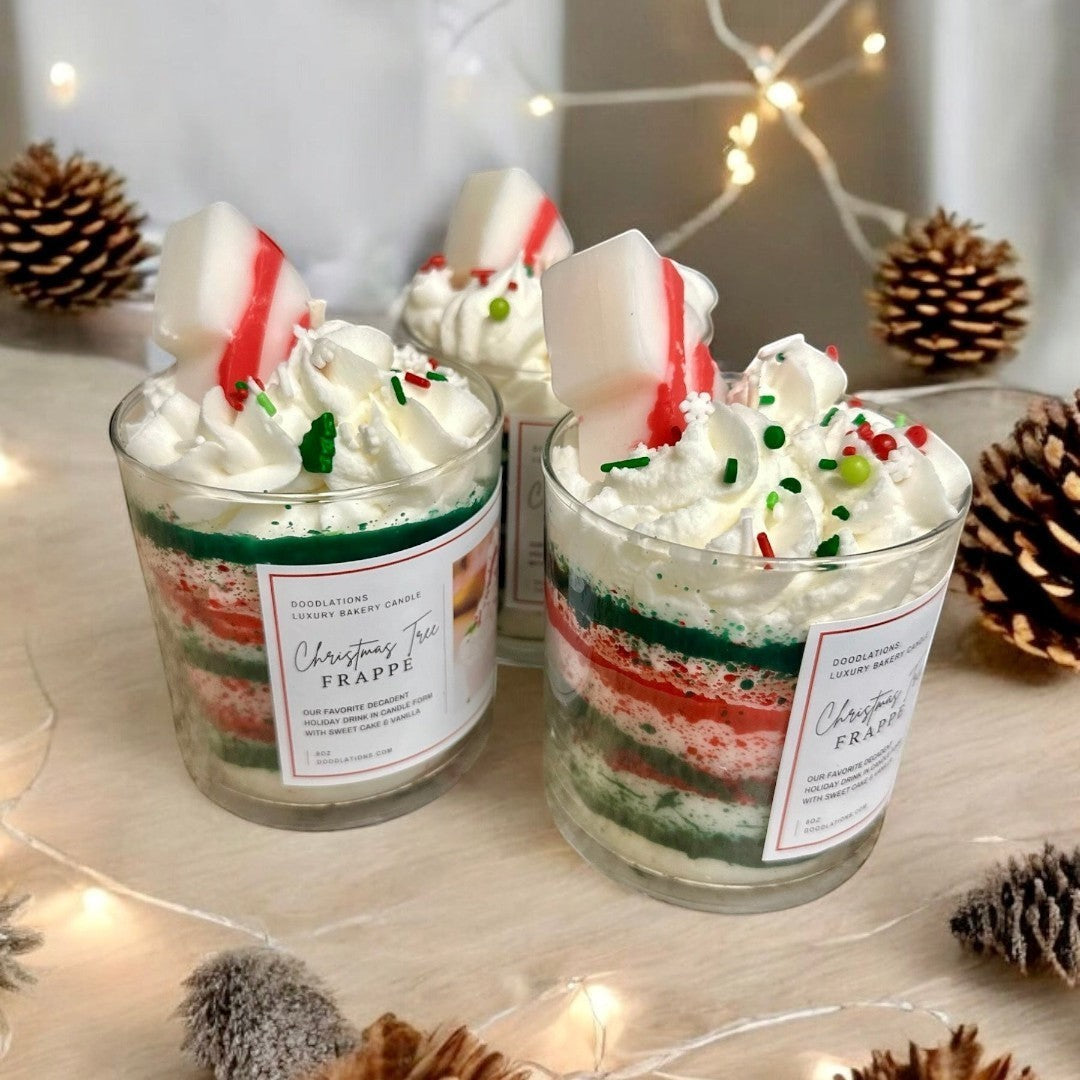 Christmas Tree Frappe candle with whipped wax topping, sprinkles, and candy cane accent.