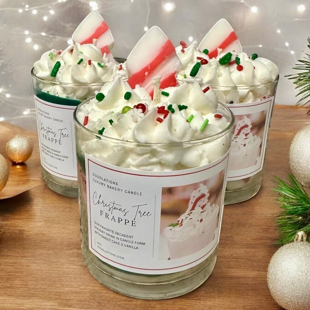 Doodlations Coffee Bar & Boutique Christmas Tree Frappe candle with whipped wax topping, sprinkles, and candy cane accent.