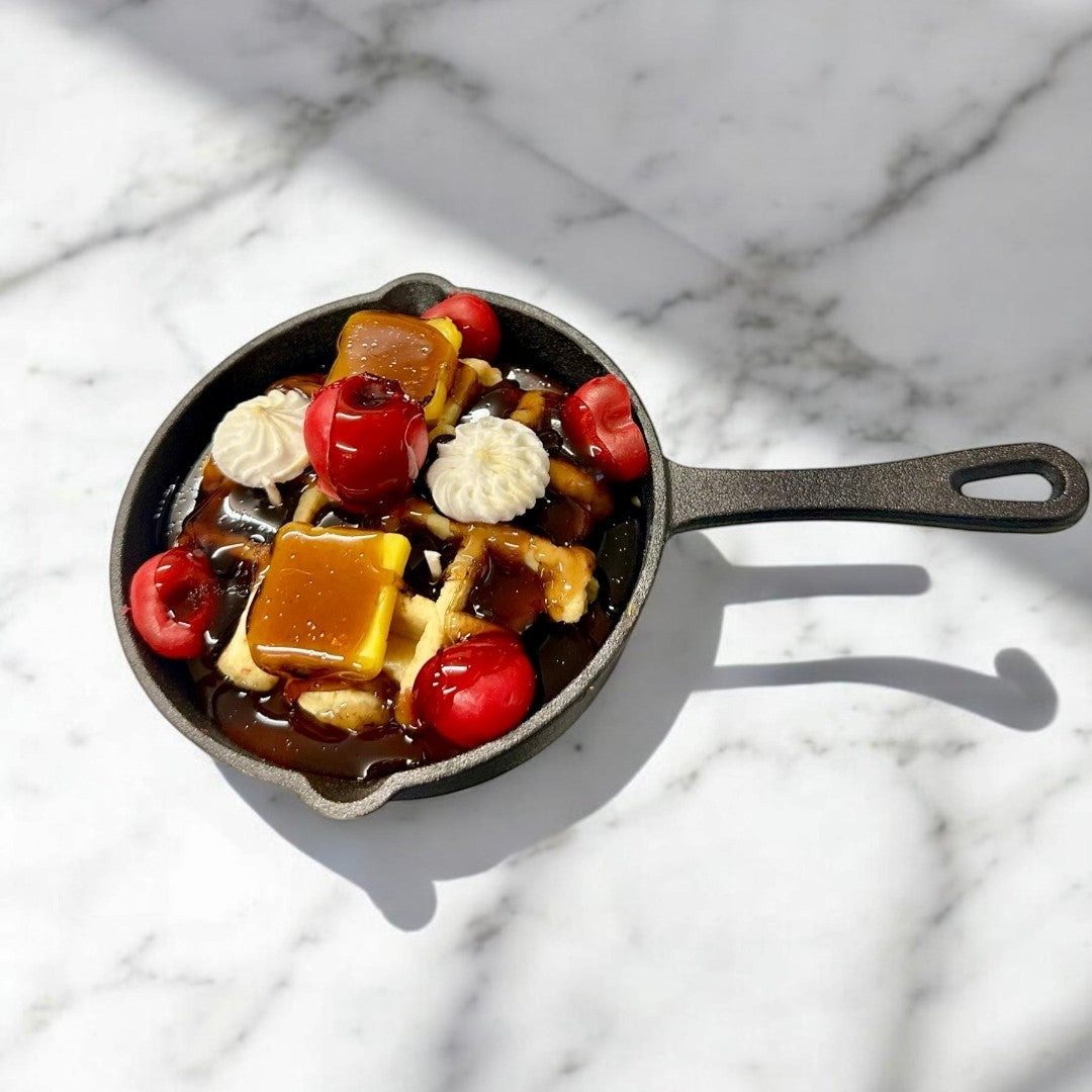 Cherry Waffle Skillet Candle with 3 wicks, topped with cherries, caramel, and whipped cream.