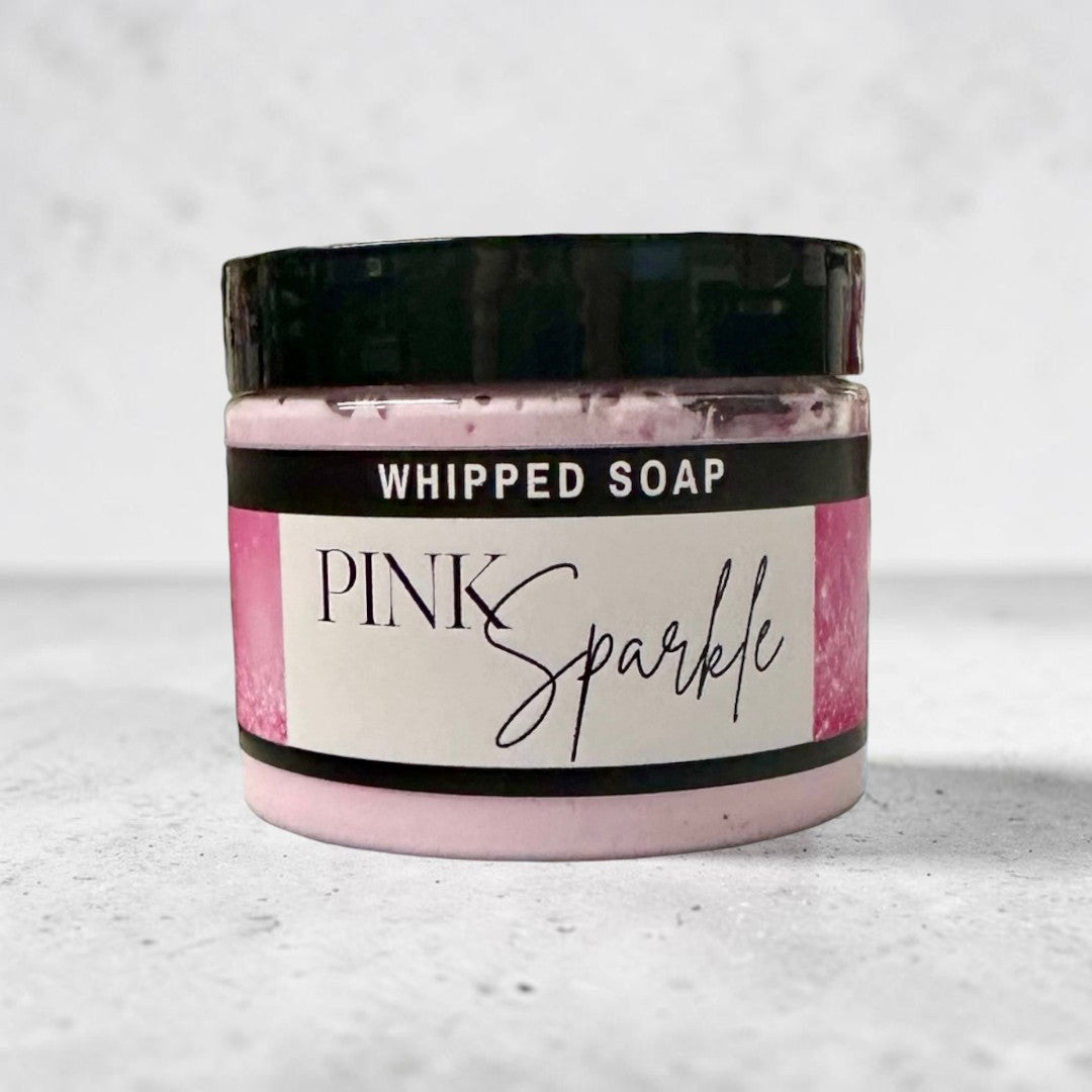 Doodlations Coffee Bar & Boutique Pink Sparkle whipped soap in a 4 oz jar with a black lid and pink label.