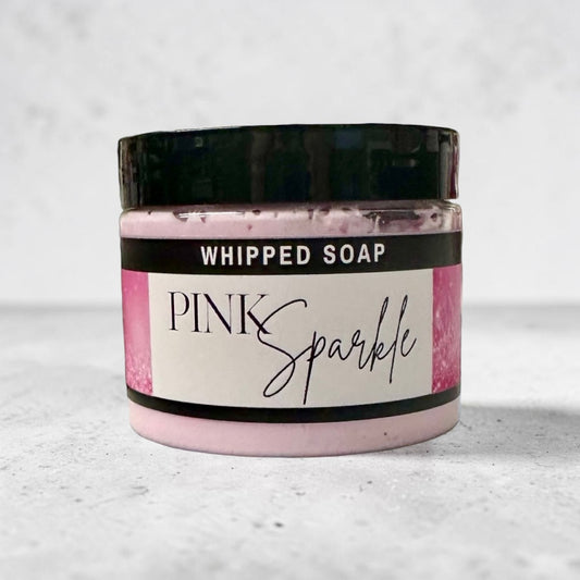 Doodlations Coffee Bar & Boutique Pink Sparkle whipped soap in a 4 oz jar with a black lid and pink label.
