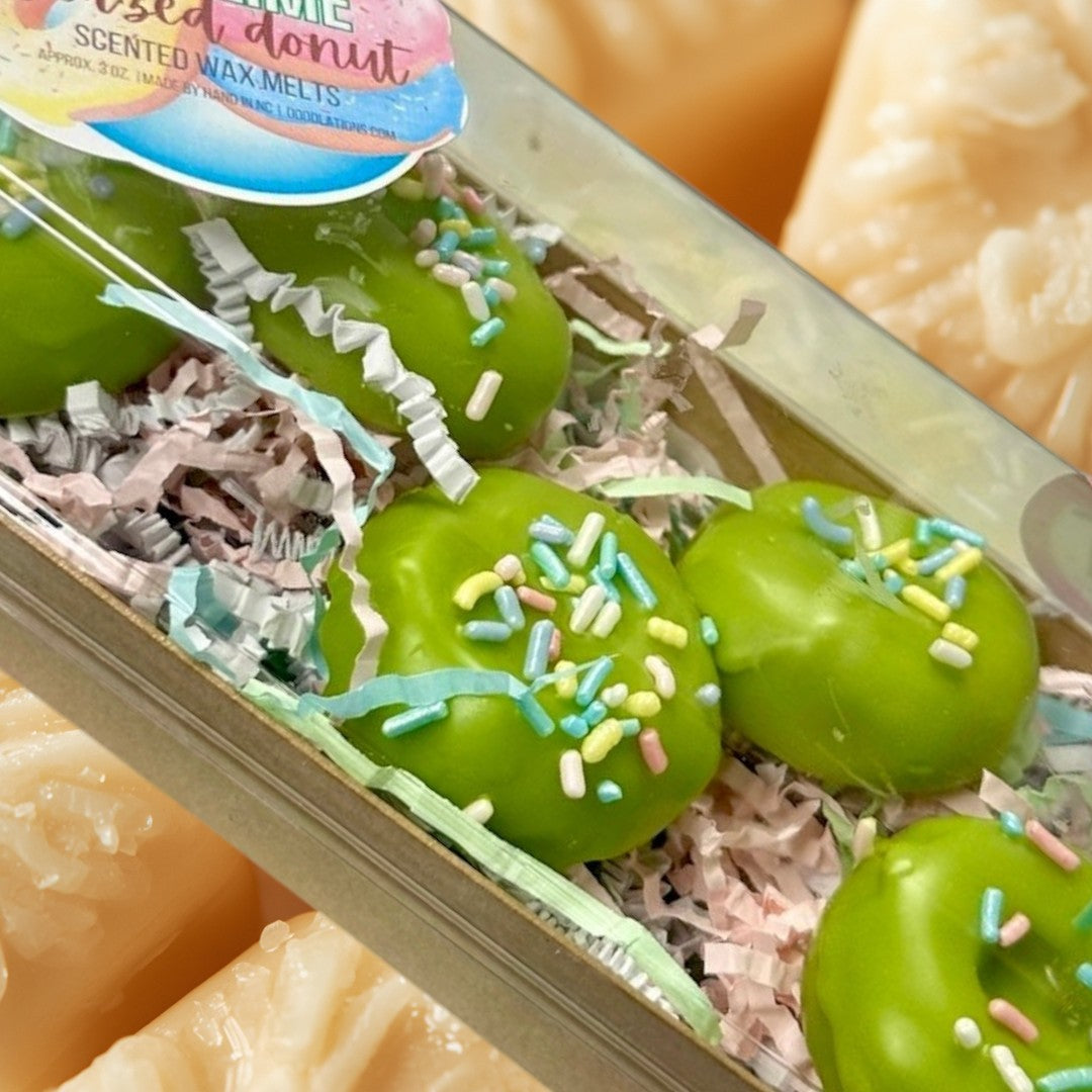 Key Lime Donut wax melts are bright green and shaped like donuts with colorful sprinkles.
