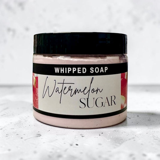 Doodlations Coffee Bar & Boutique Watermelon Sugar whipped soap in a 4 oz jar with a black lid and fruity label.